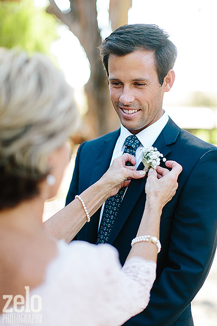 mother-son-wedding-moment-boutonniere