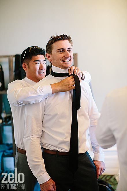 groom-tying-his-tie