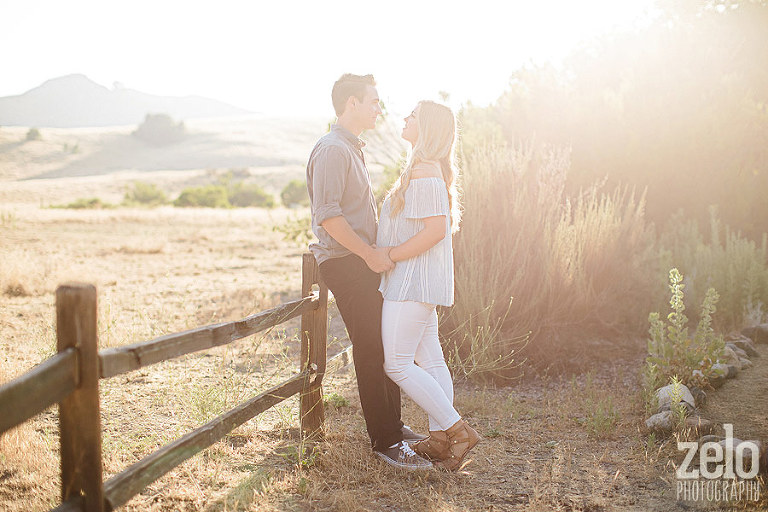 hazy-engagement-photos-sun-flare-sunset